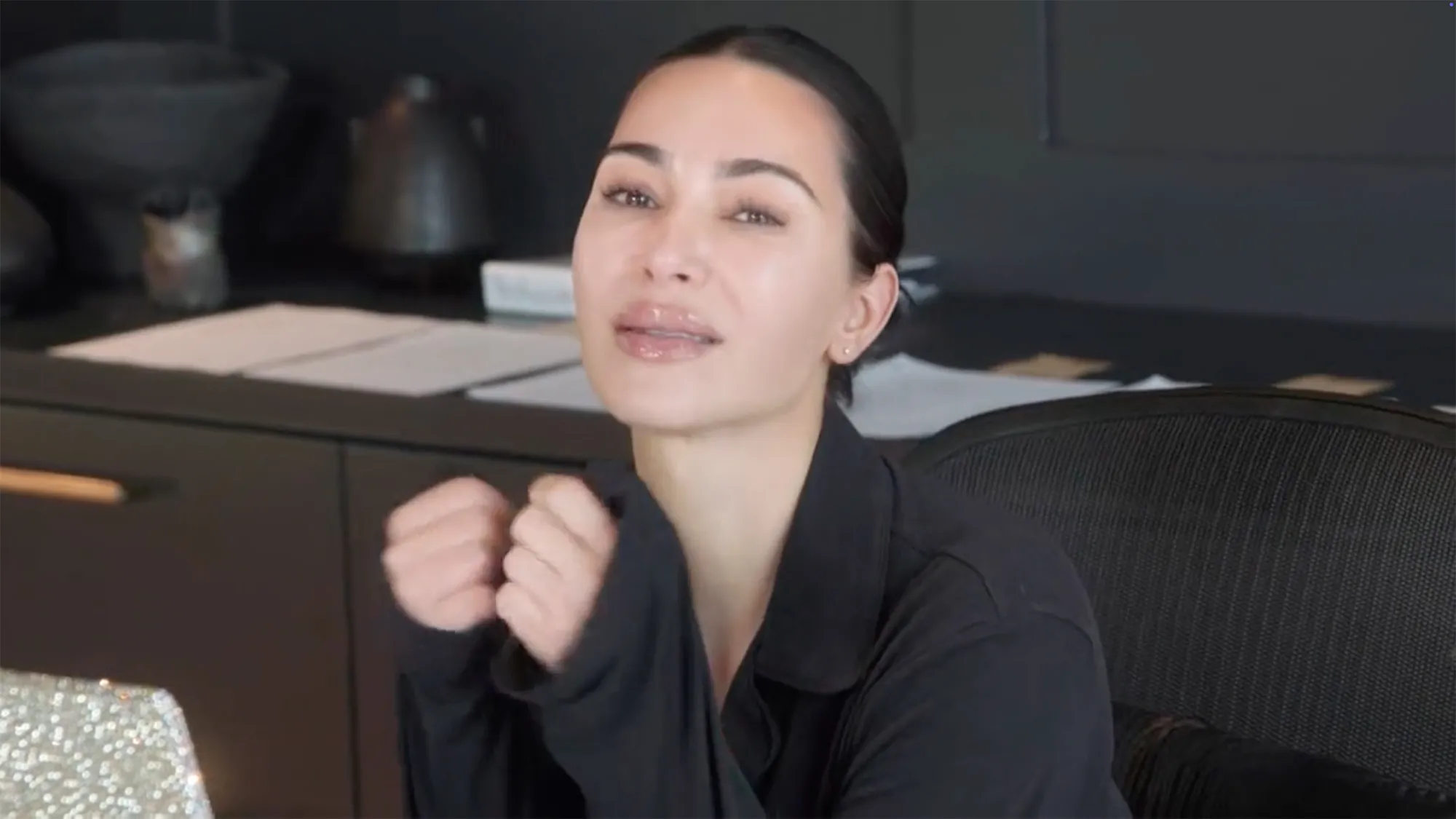 Kim Kardashian crying and looking frustrated while studying.