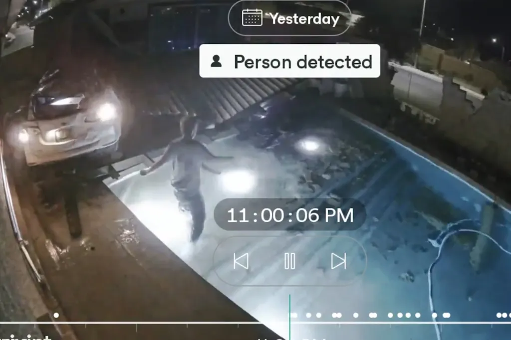 Cletis Reed runs into the shallow end of the pool to help the driver.