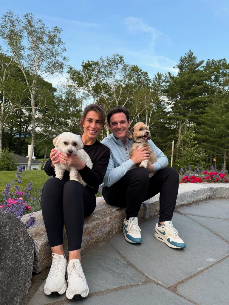 Alyssa Farrah Griffin and her husband Justin posing with their two dogs.
