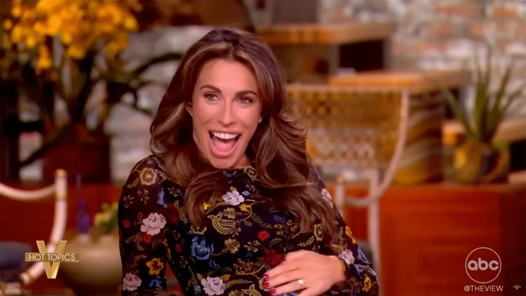 Alyssa Farah Griffin, host of The View, holding her stomach and smiling, announcing her pregnancy.