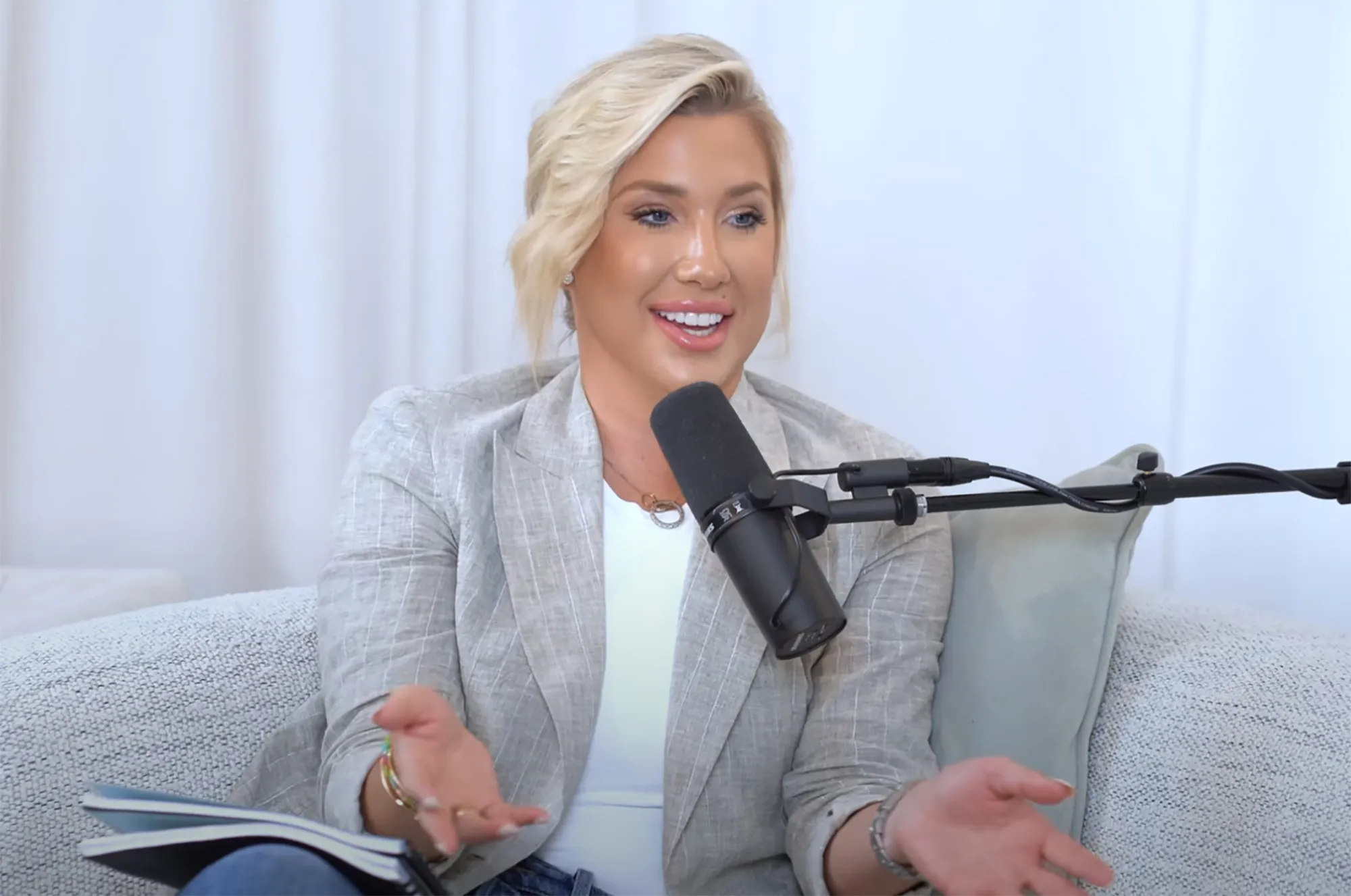 Savannah Chrisley speaking into a microphone.