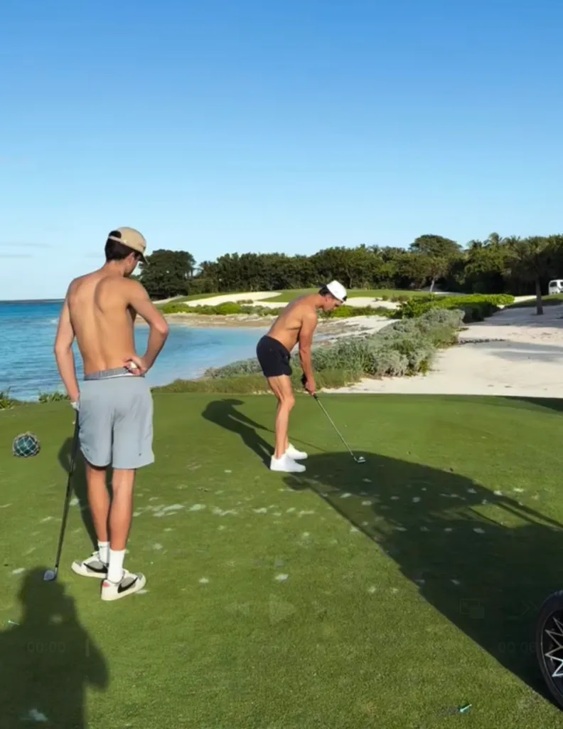 Tom Brady and his son Jack playing shirtless golf.