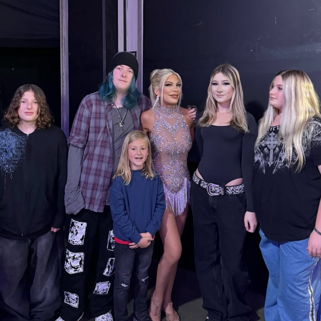 Tori Spelling posing with her five children.