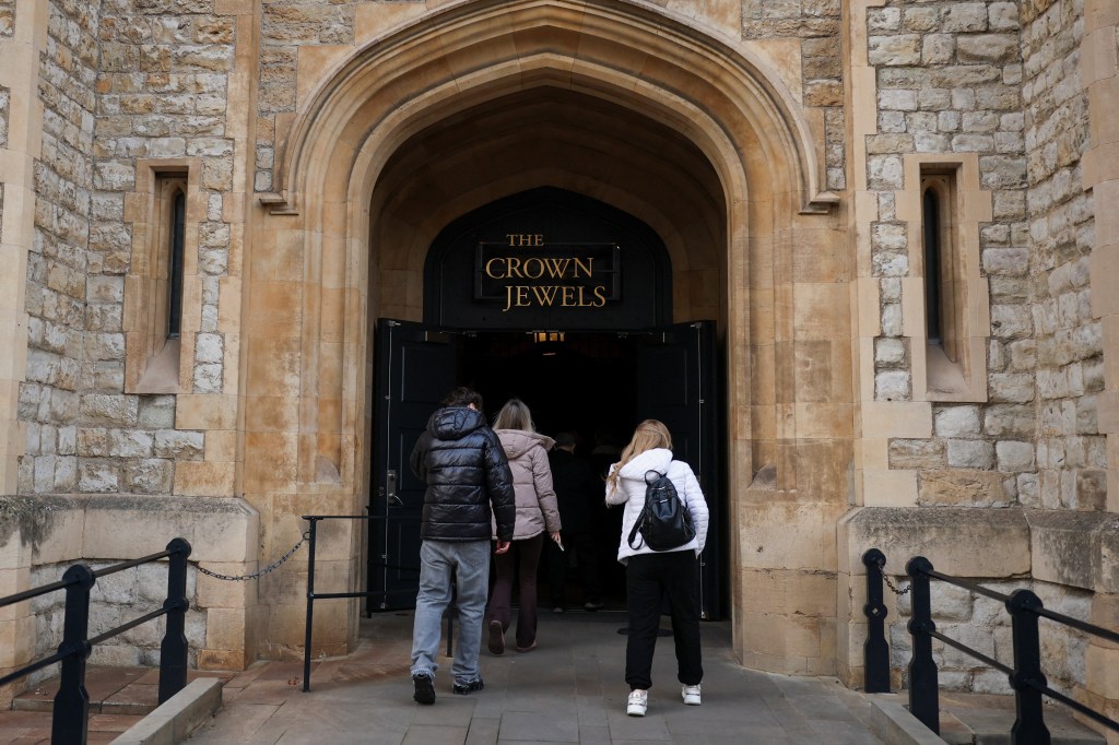 Tourists enter the Crown Jewels exhibition at the Tower of London.