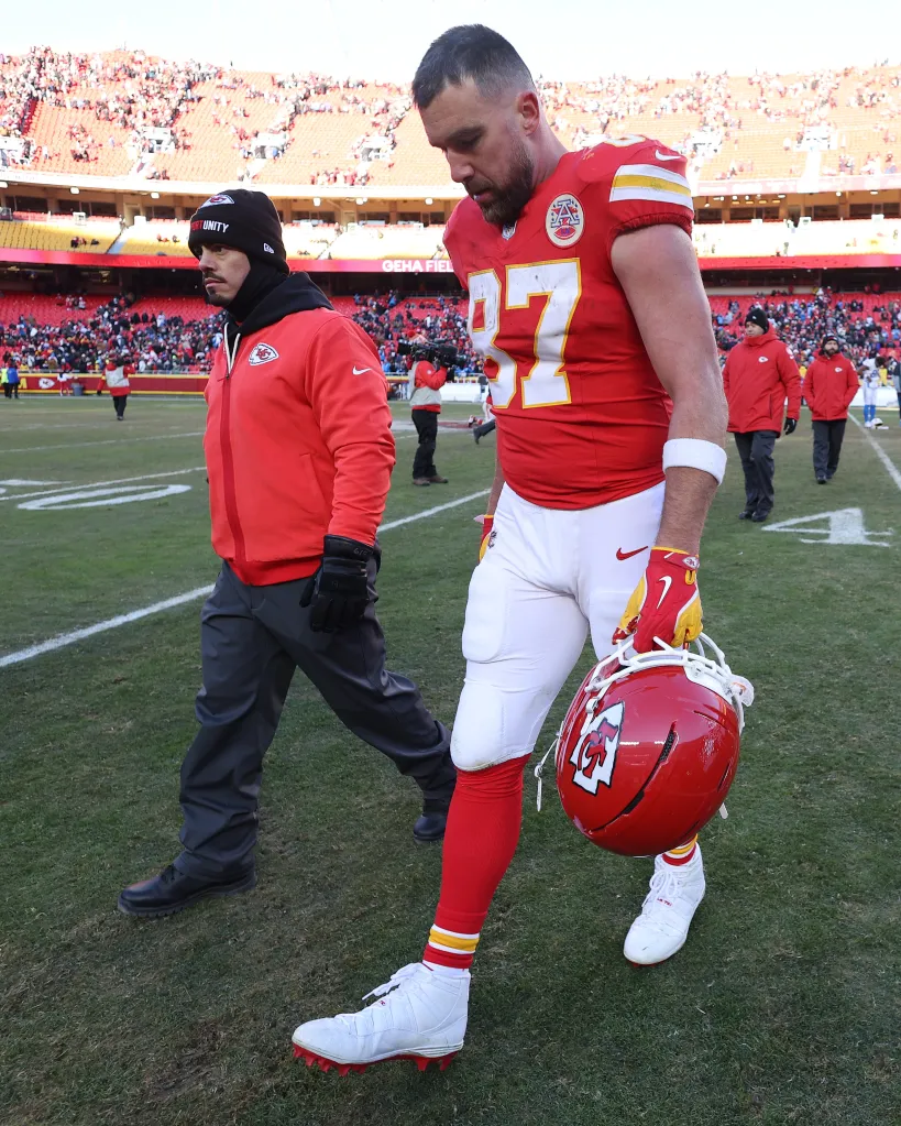 Travis Kelce #87 of the Kansas City Chiefs walks off the field after losing a game.