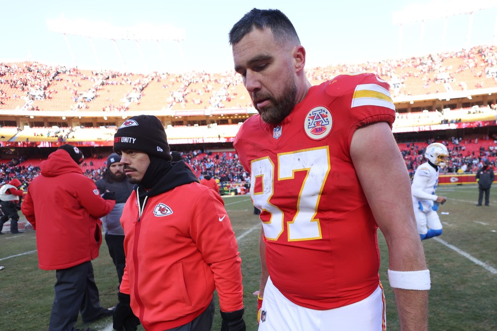 Kansas City Chiefs player Travis Kelce (87) walks off the field after losing to the Los Angeles Chargers.