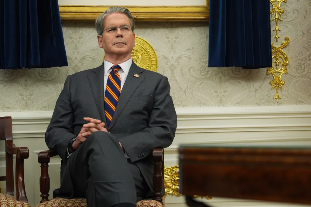 Treasury Secretary Scott Bessent sitting in the Oval Office.