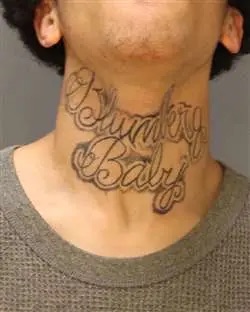 Tyvine Jones' neck tattoo documented after his arrest.