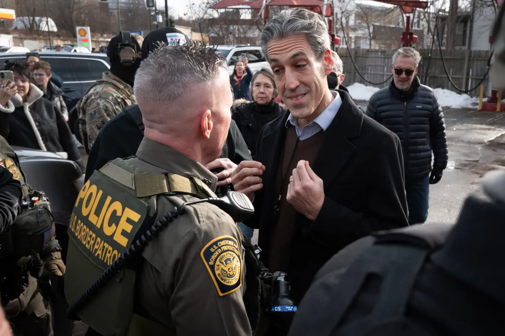 U.S. Border Patrol Chief Gregory Bovino speaking to Evanston Mayor Daniel Biss while on patrol in Evanston, Illinois.