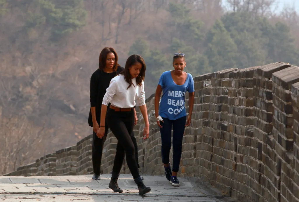 Michelle Obama and her two daughters Sasha and Malia visit the Great Wall of China.