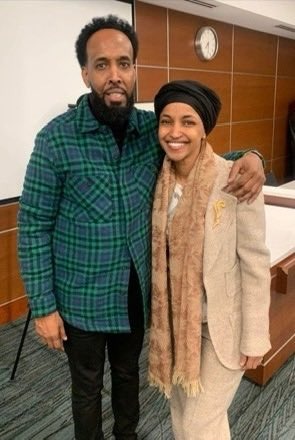 A man and a woman standing close together.