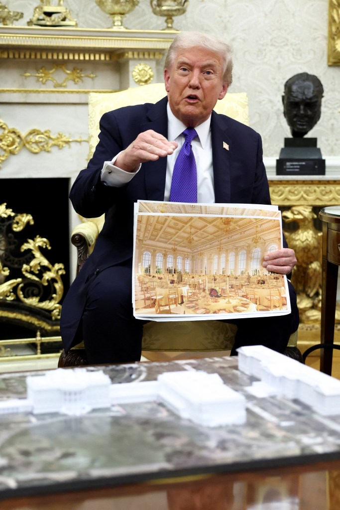 President Trump holds a photo of a ballroom.