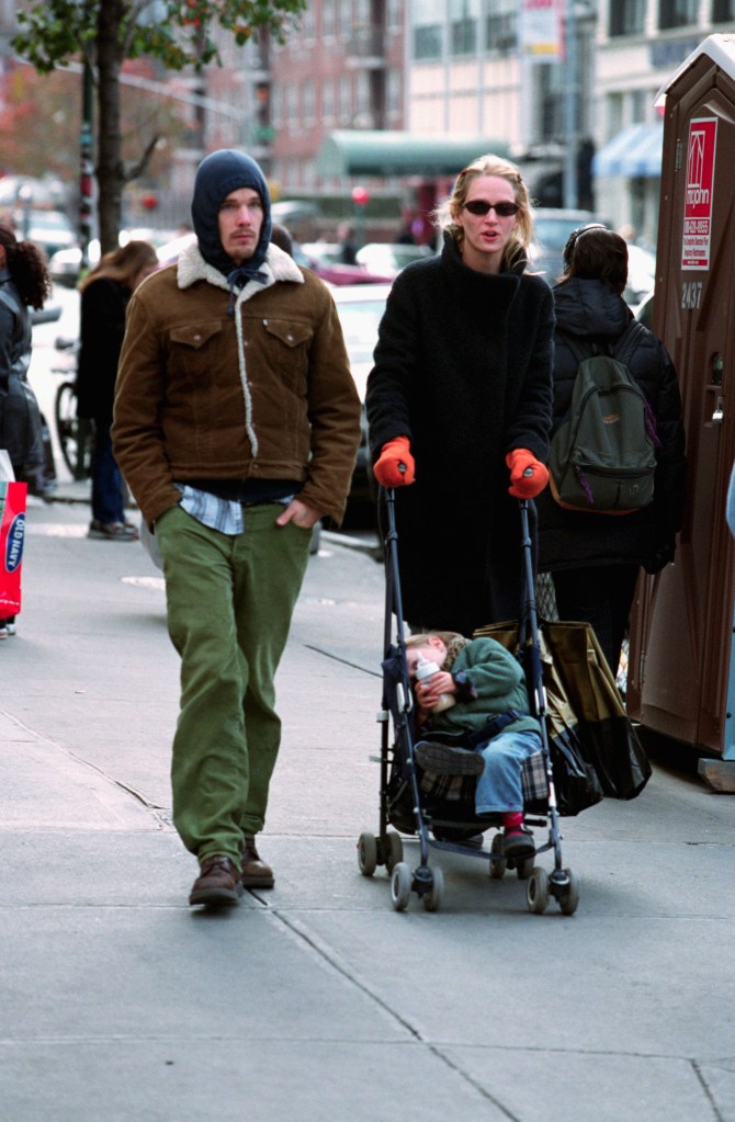 Uma Thurman and Ethan Hawke with their baby, Maya Ray, on 6th Avenue in New York City.