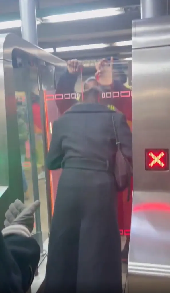 An unidentified woman is seen with her head stuck in the new MTA turnstile at the Broadway Lafayette station in a video posted to Instagram.