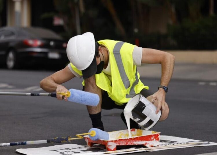 Activists paint Westwood crosswalk to improve safety. Police shut down effort, cite volunteer for vandalism