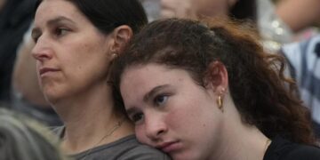 As thousands gather at Bondi Beach to mourn victims, Australian leader is booed
