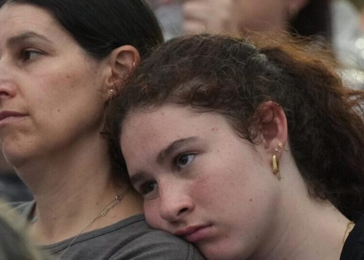 As thousands gather at Bondi Beach to mourn victims, Australian leader is booed