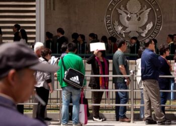 Apple, Google and others tell some foreign employees to avoid traveling out of the country