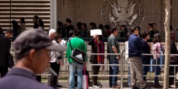 Apple, Google and others tell some foreign employees to avoid traveling out of the country