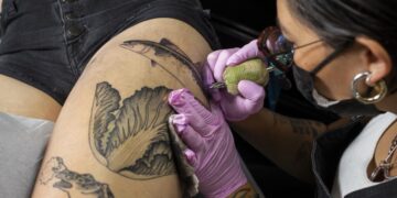 Tattoo ink moves through the body, killing immune cells and weakening vaccine response