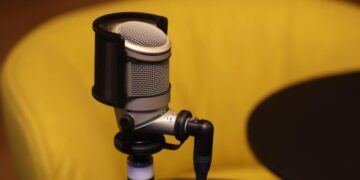 Podcast industry is divided as AI bots flood the airways with thousands of programs