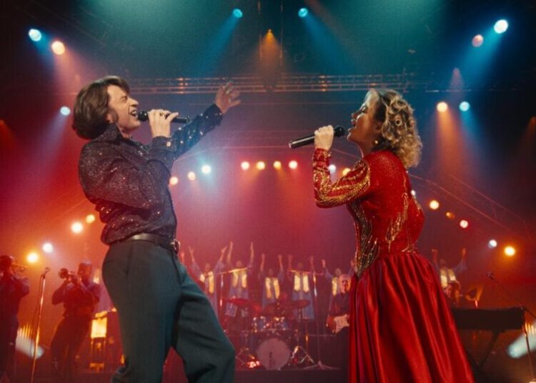 ‘Song Sung Blue,’ starring Hugh Jackman and Kate Hudson, is corny comfort cinema with bittersweet notes