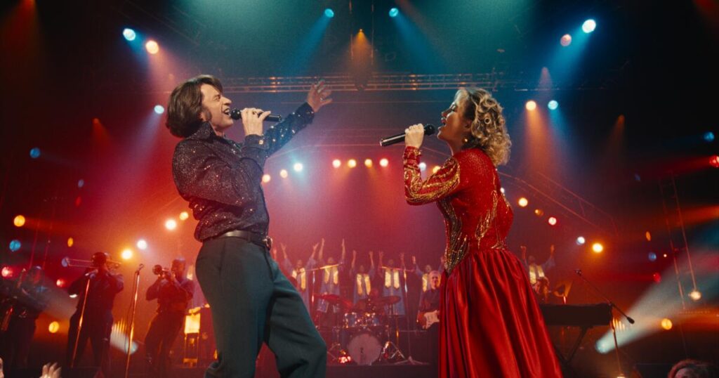 ‘Song Sung Blue,’ starring Hugh Jackman and Kate Hudson, is corny comfort cinema with bittersweet notes