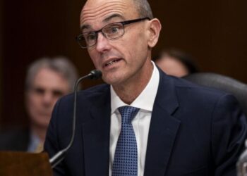 Why is McKinsey cutting thousands of jobs during its 100th anniversary year?