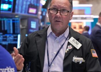 Wall Street pulls back from its record heights