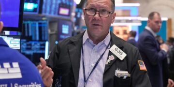 Wall Street pulls back from its record heights