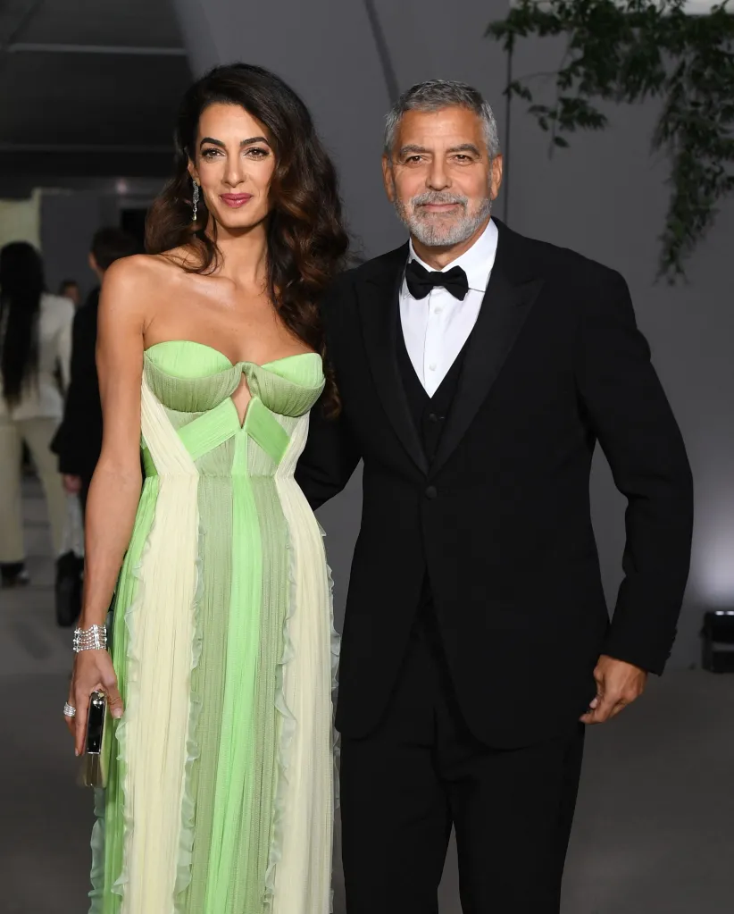 Amal and George Clooney pose at the 2nd Annual Academy Museum Gala.