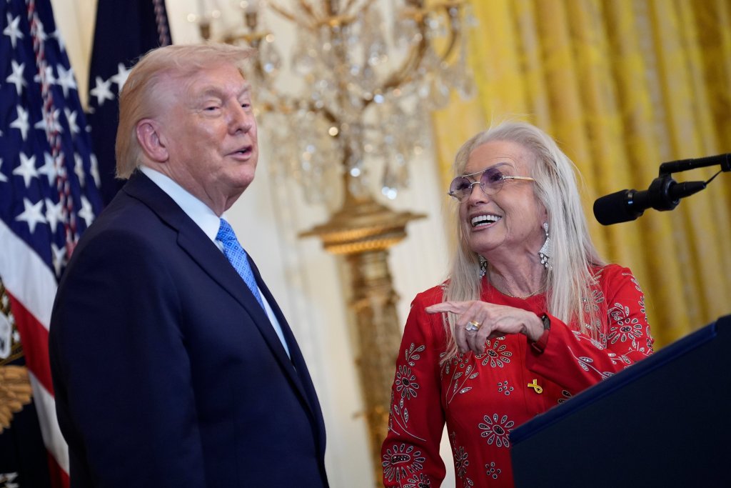 Donald Trump talks with Miriam Adelson during a Hanukkah reception in the East Room at the White House.
