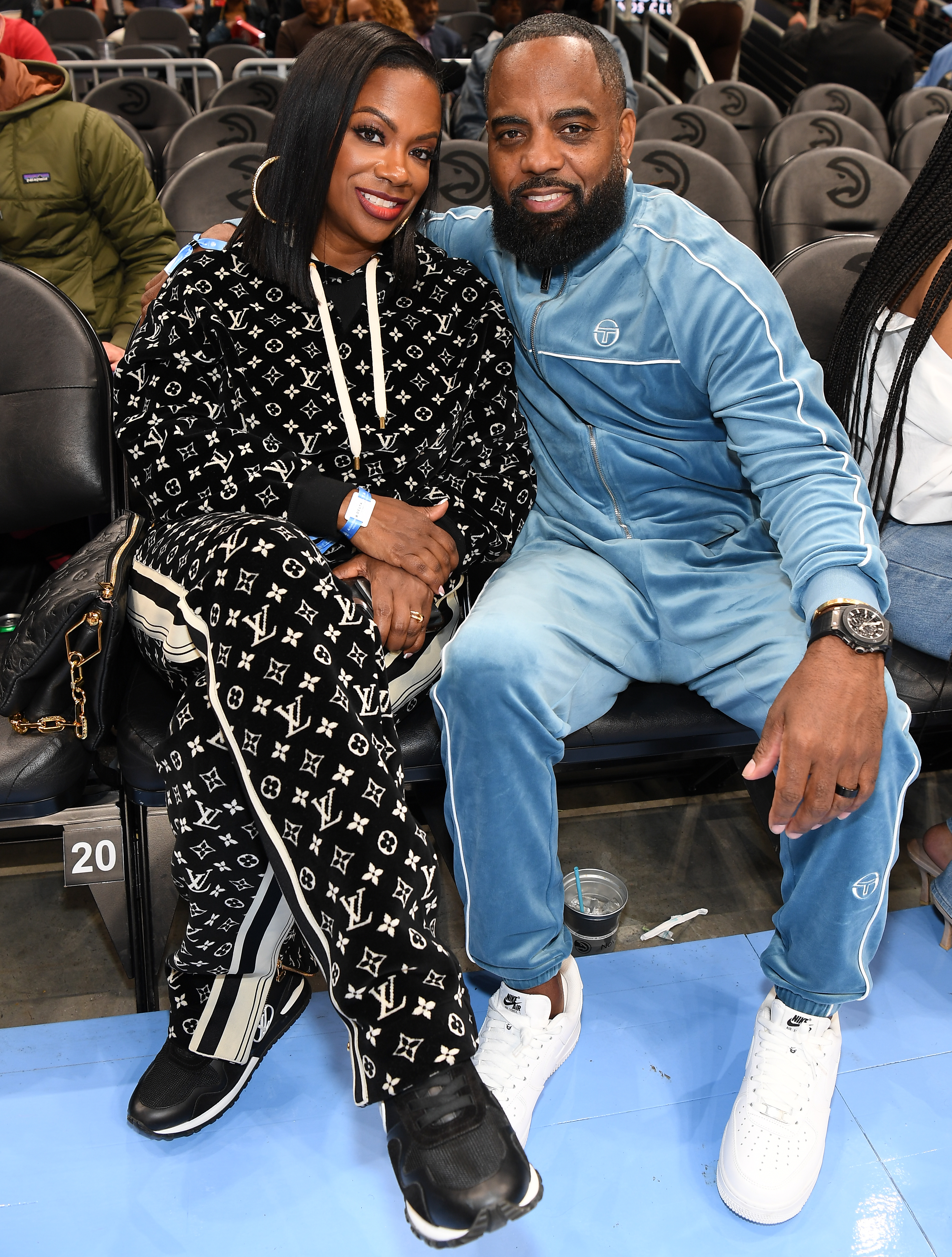 Kandi Burruss and Todd Tucker at a basketball game.