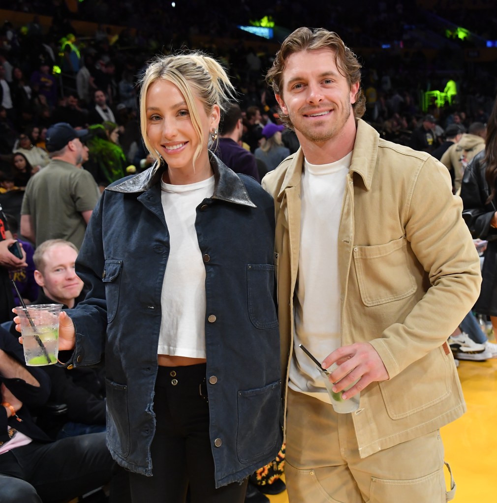 Alix Earle and Braxton Berrios at a basketball game.