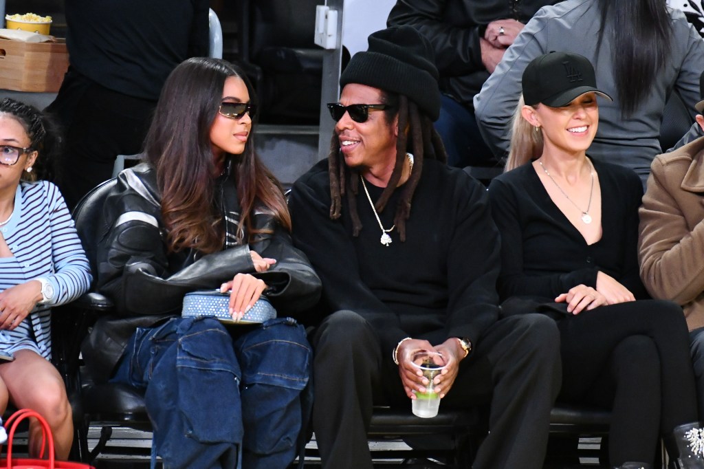 Jay-Z and Blue Ivy Carter at a basketball game.