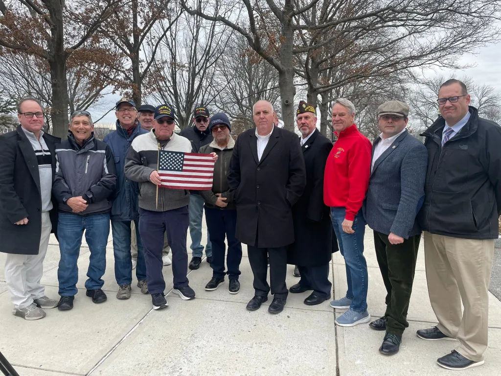 Boston City Councilor Ed Flynn and local veterans convene at one of the memorials after the vandalism.