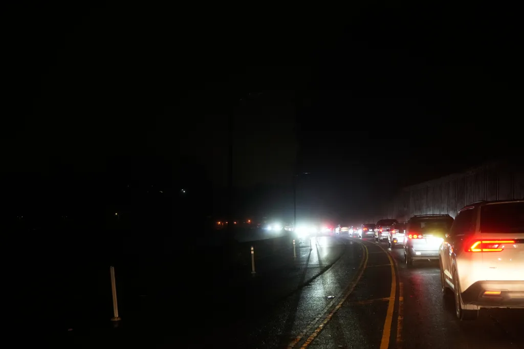 Traffic builds up on the darken streets of San Francisco during the power outage on Dec. 20, 2025.