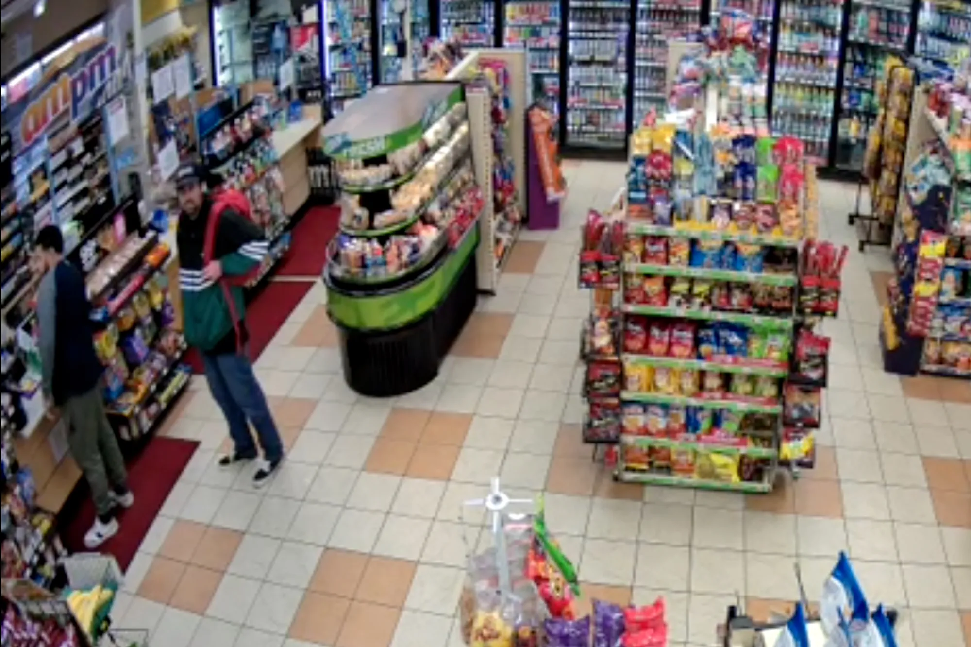 Security camera footage of Nick Reiner in a gas station convenience store.