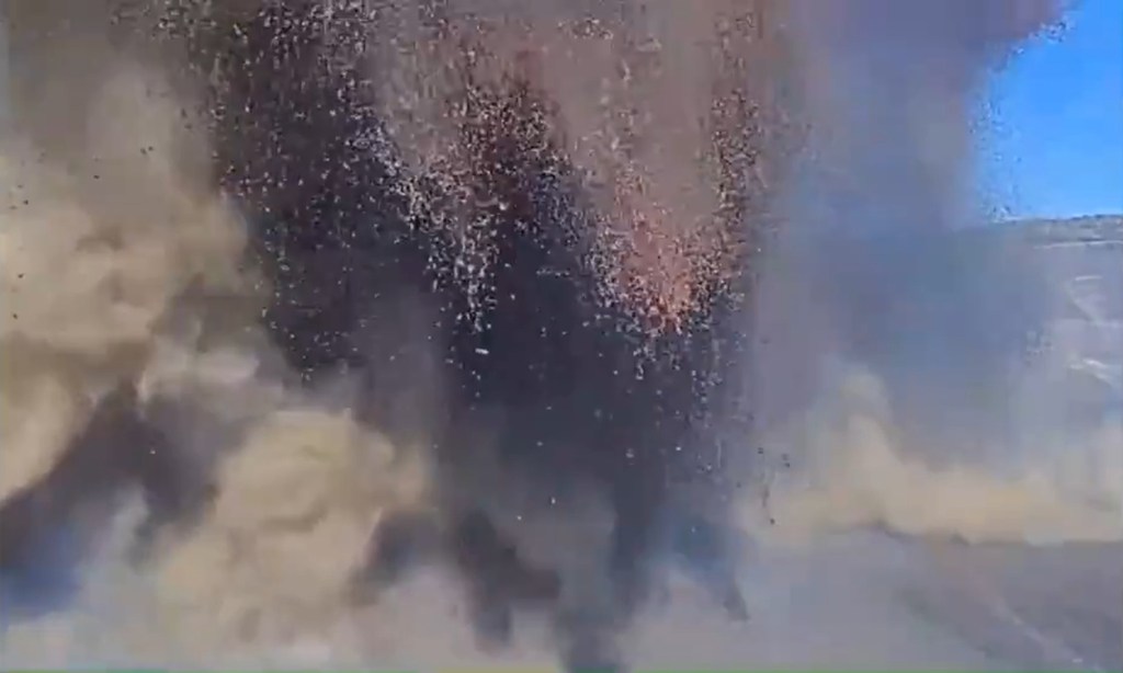 Camera lens buried by tephra from an inclined lava fountain.