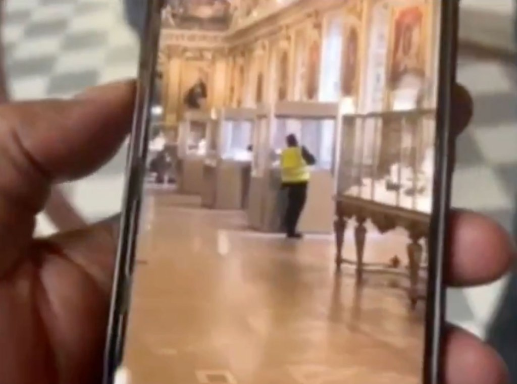Video shows one of the suspected Louvre jewel thieves brazenly cutting through a glass case using a mini chainsaw before making off with the loot during Sunday's heist at the Paris art gallery