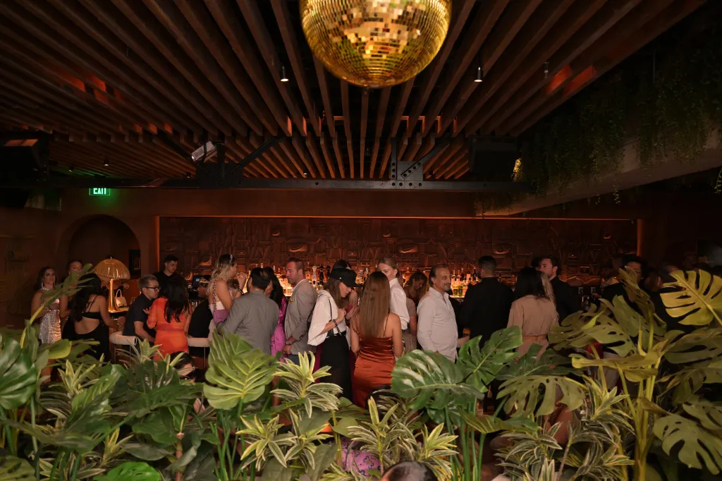 People gathered for the BASIC Magazine 20th Anniversary Issue Release at MILA Miami.