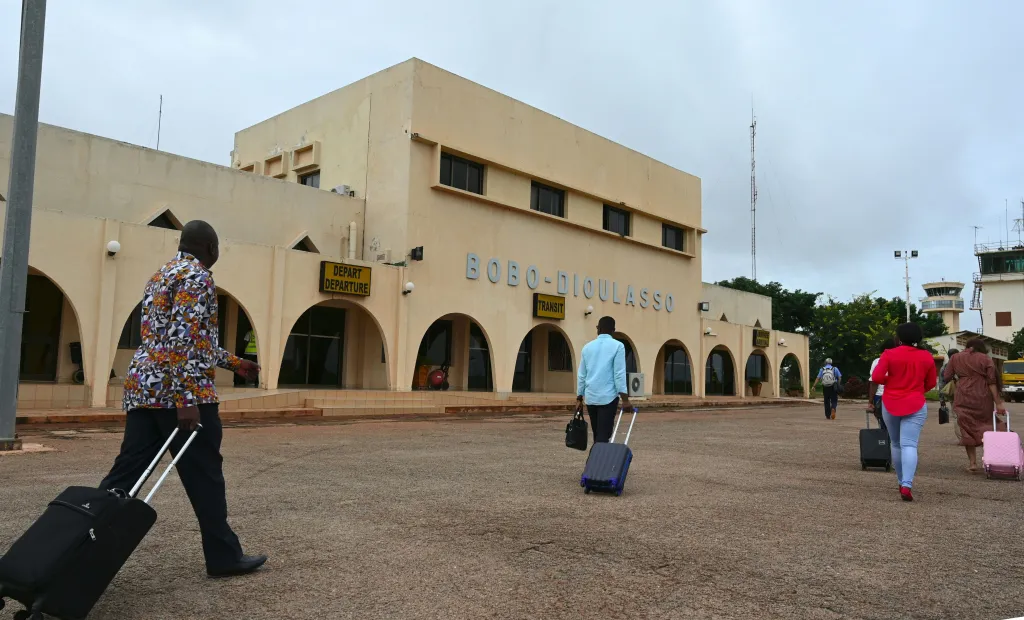 Travelers arriving at the Bobo Dioulasso Airport are photographed, in Bobo Dioulasso, on September 18, 2019.