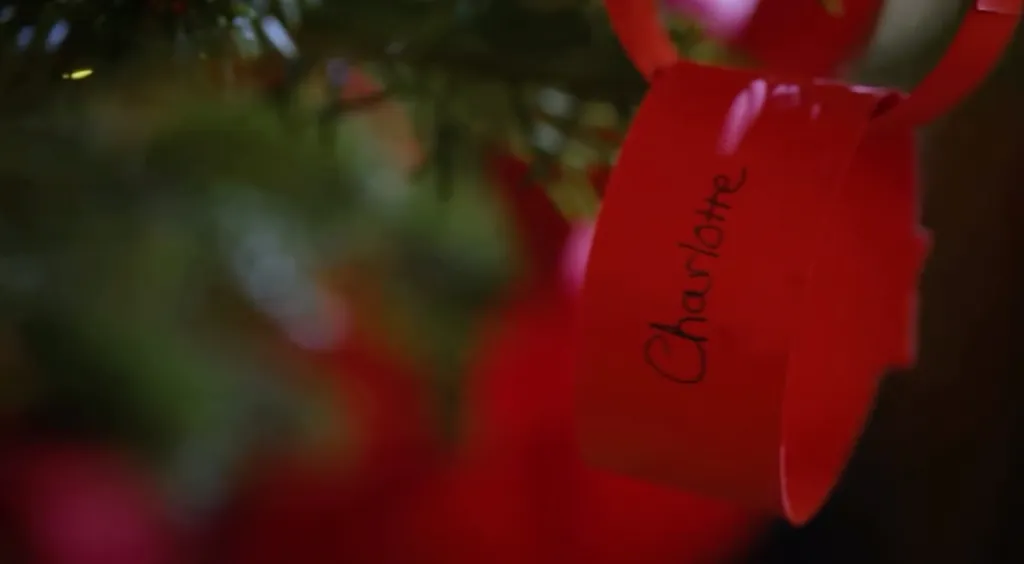 A red ribbon with the name 