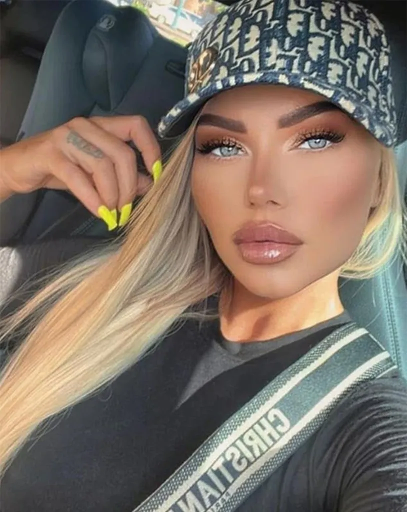 Tatiana Dokhotaru in a car, wearing a patterned cap and seatbelt with 