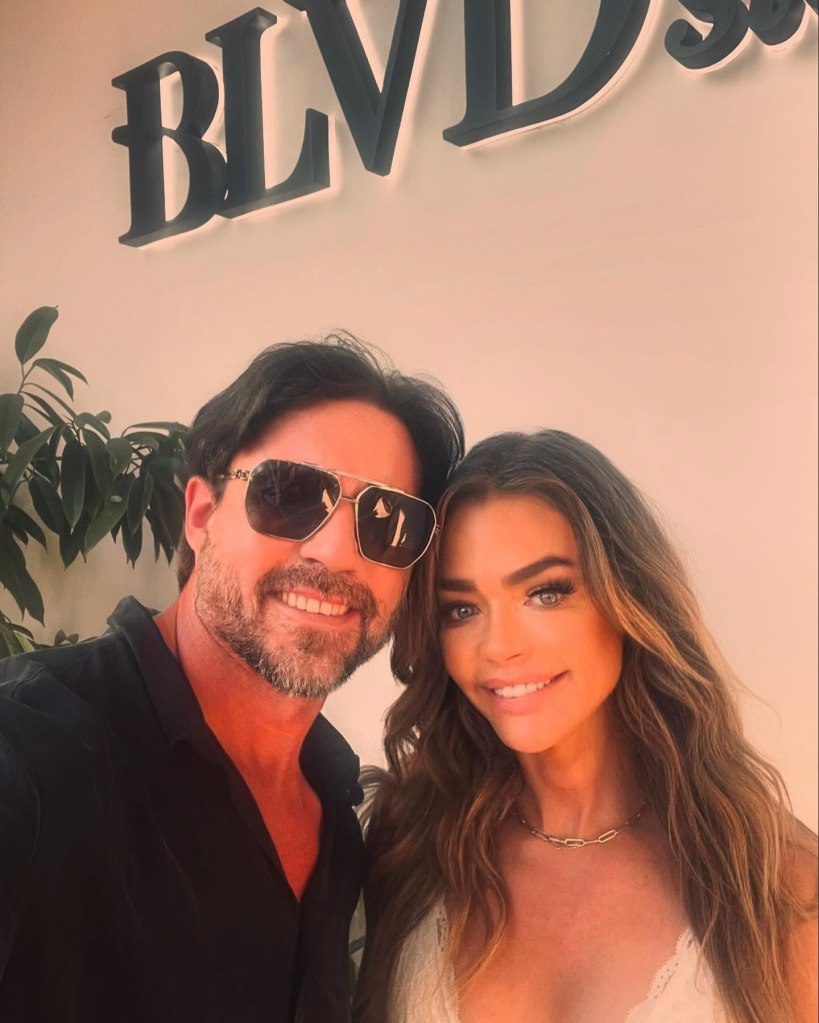Denise Richards and Aaron Phypers posing for a photo.