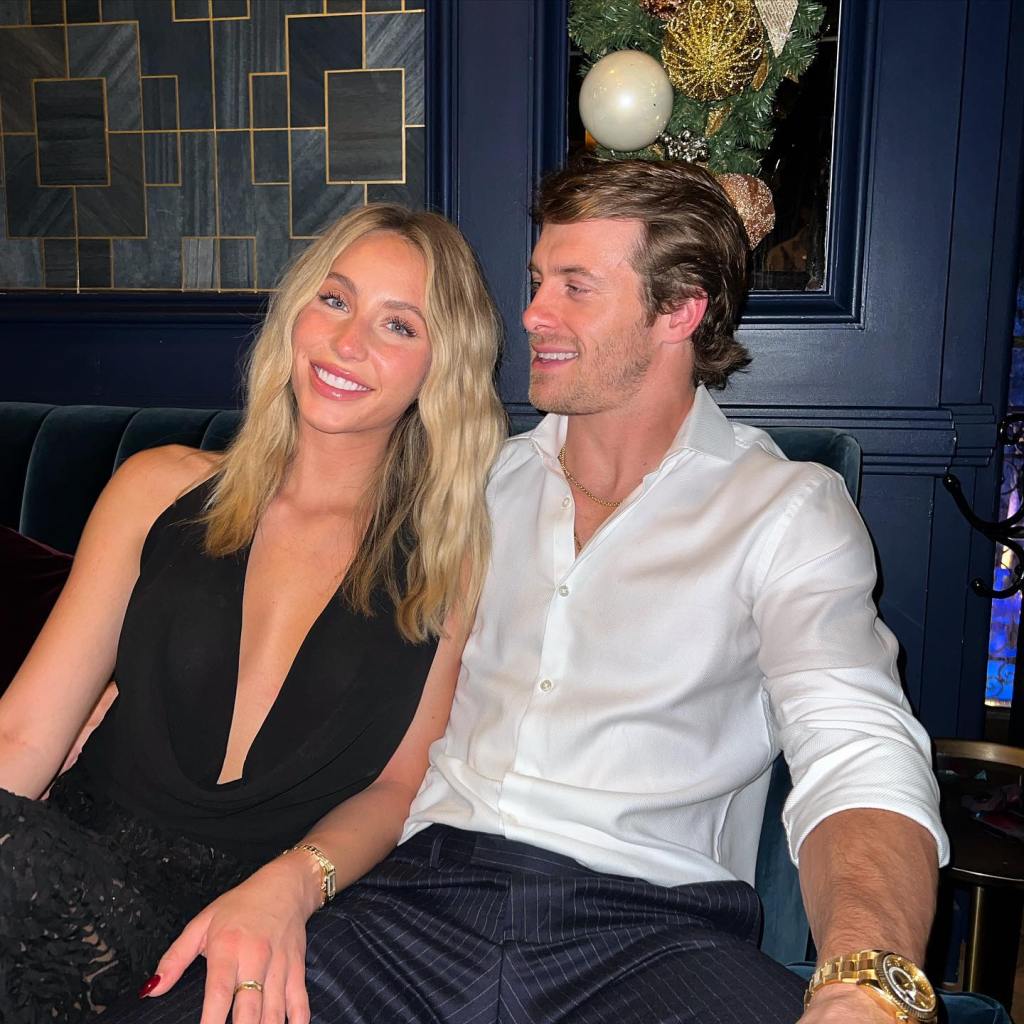 Alix Earle and Braxton Berrios sitting together on a couch.