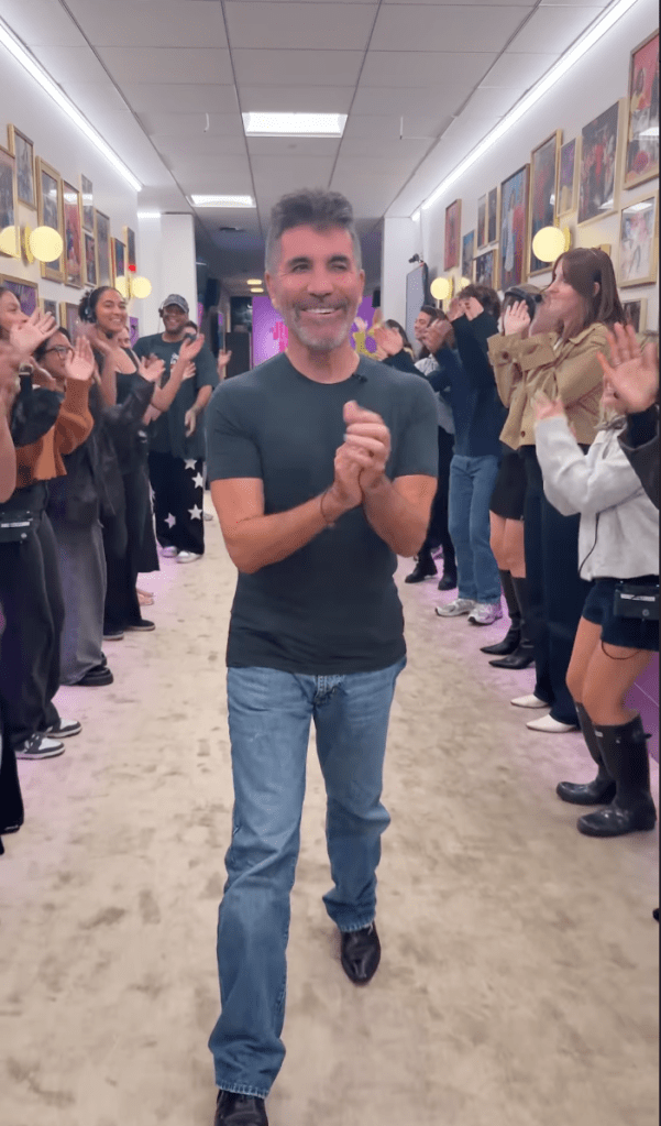Simon Cowell poses in a video.
