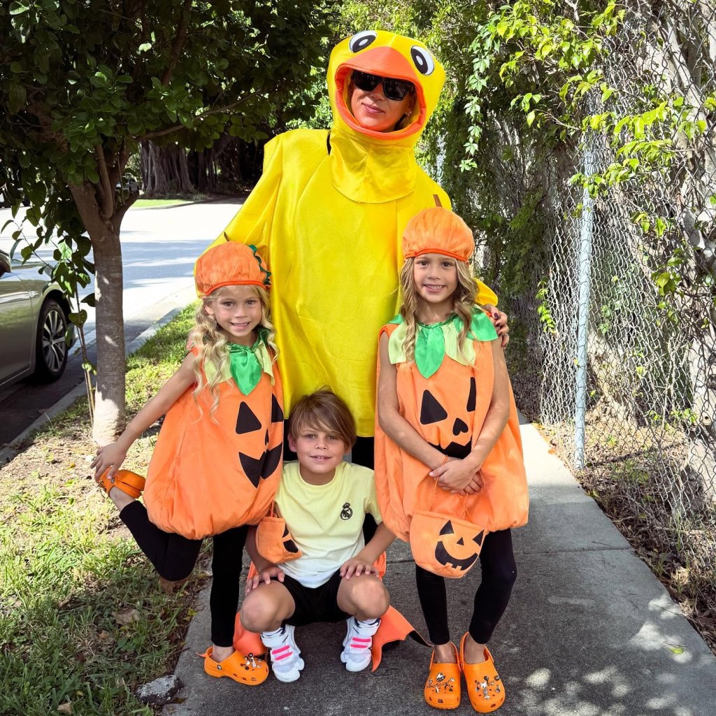 Anna Kournikova in a duck costume with her three children dressed as pumpkins.