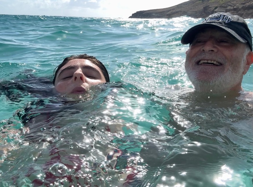 Rob Reiner and his wife Romy floating in the ocean.