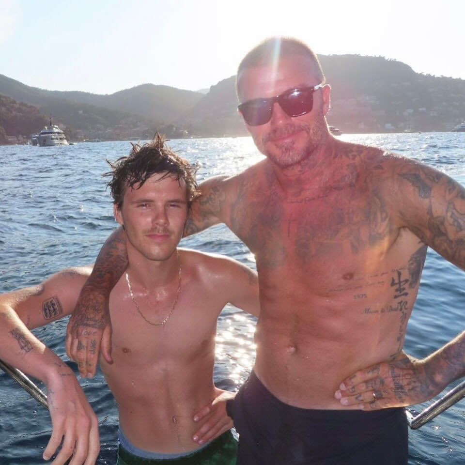 David Beckham and his son Brooklyn in the water.